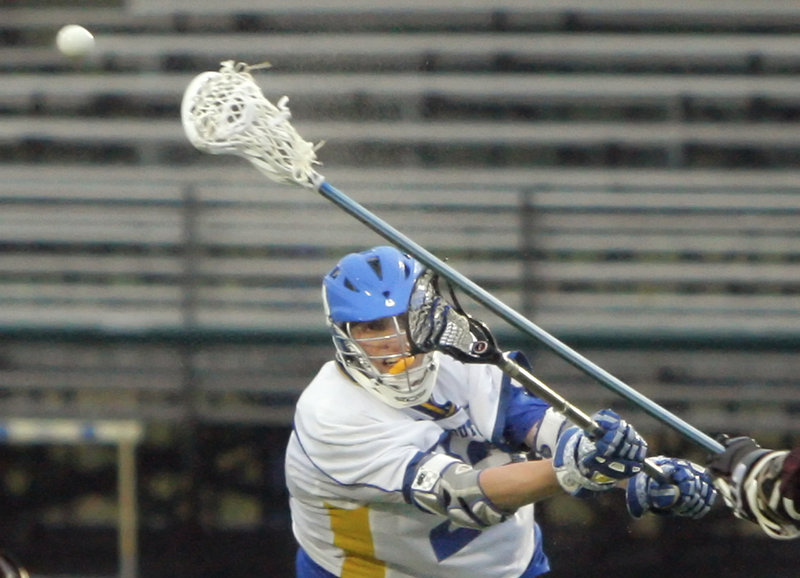 Jack Cooleen of Falmouth takes a shot during his team’s 15-7 boys’ lacrosse win Monday night against Greely. The Yachtsmen raced to an 8-0 lead in the first quarter and got goals from eight players, including two by Cooleen.