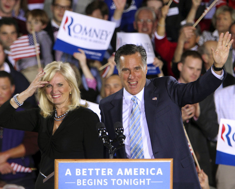 GOP presidential candidate Mitt Romney and his wife, Ann, wave to supporters Tuesday in Manchester, N.H. Romney won primaries in five Northeastern states Tuesday.