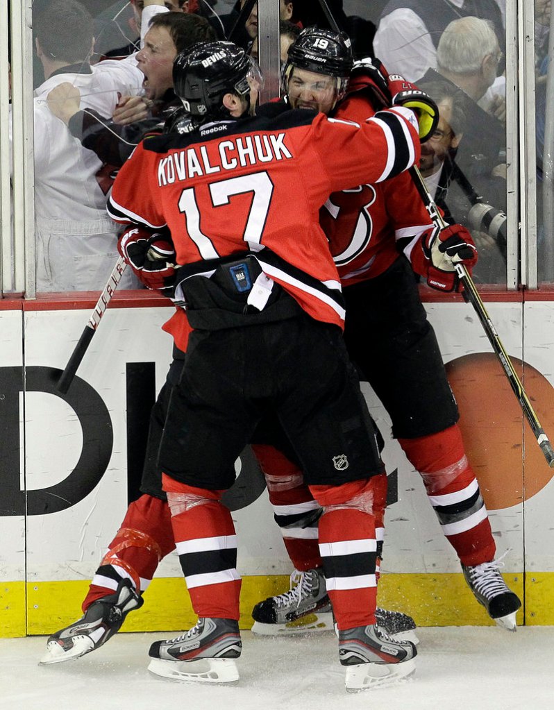 Travis Zajac, right, celebrates with Ilya Kovalchuk after scoring in OT Tuesday night in Newark, N.J. The Devils beat the Panthers 3-2 to force a Game 7 in Florida.