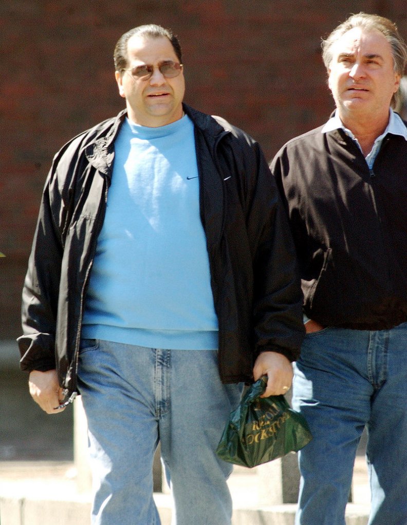 Reputed New England mafia leader Anthony DiNunzio, left, walks with Anthony Gambale, right, on Hanover Street in Boston’s North End in 2002. DiNunzio was taken into FBI custody Wednesday.