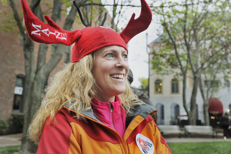 Suzanne Hawley and her family were visiting Portland from their home in New Boston, N.H., and decided to take part in the cash mob event at Lisa-Marie’s Made in Maine on Thursday evening. Marketing agency Local Thunder gave her a lobster hat to wear.