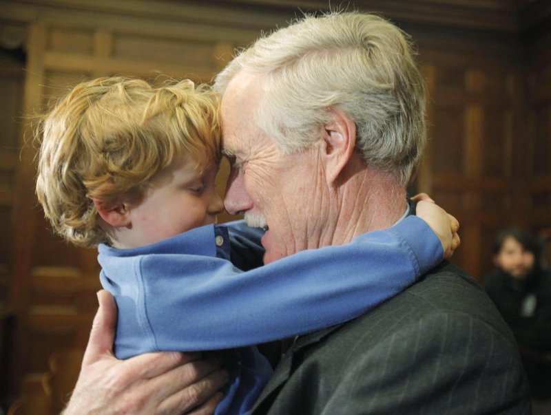 Former Gov. Angus King speaks to his grandson Gus King in March after announcing his intention to run for Sen. Olympia Snowe’s Senate seat.