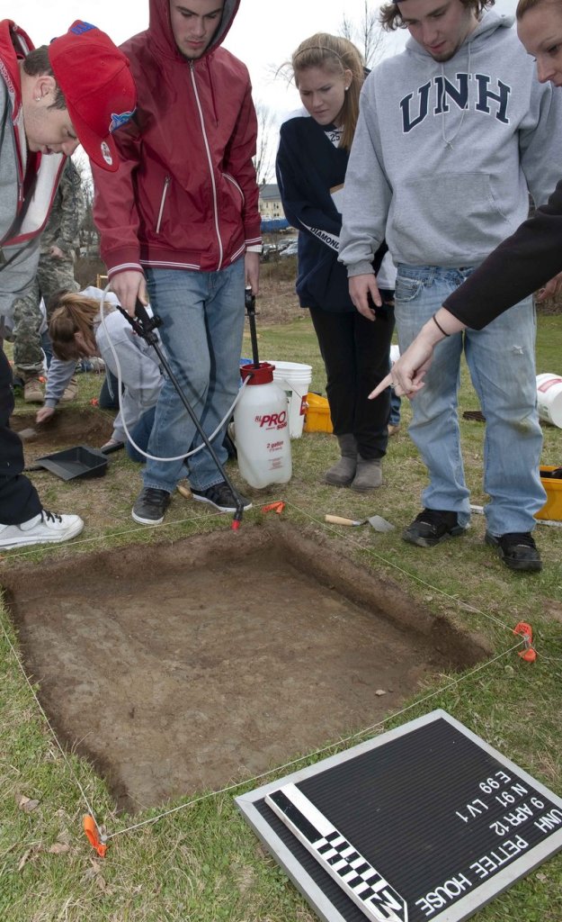 Assistant Professor Meghan Howey’s anthropology class performs an archaeology dig on the site of the former Pettee House in Durham, N.H., in this April 9 photo provided by the University of New Hampshire.