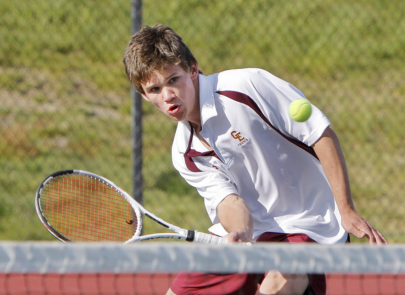 Matt Gilman of Cape Elizabeth returns a shot against Falmouth’s Justin Brogan in the No. 1 singles match Friday. Gilman earned a 7-6 (4), 6-4 victory over Brogan, last year’s state singles runner-up, but Falmouth took the other two singles matches and No. 2 doubles for a 3-2 win.