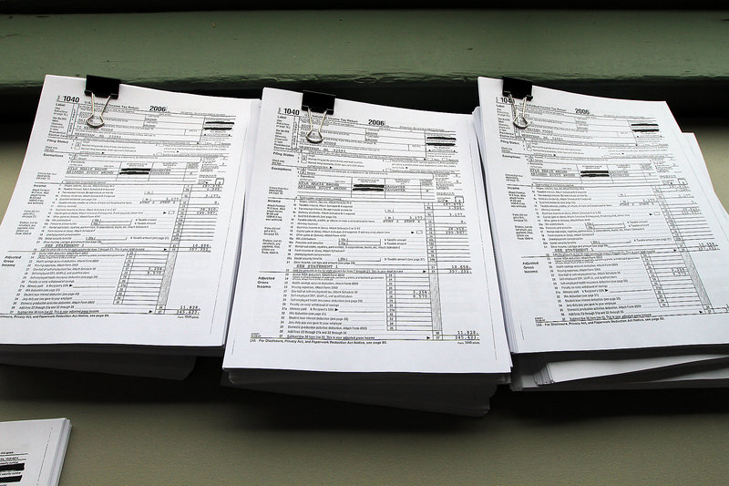 Documents showing the last six years of Republican U.S. Sen. Scott Brown’s income tax forms are displayed in his South Boston headquarters Friday.