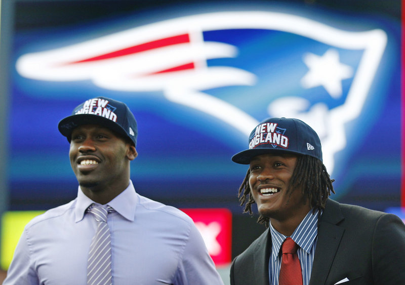 Chandler Jones, left, and Dont’a Hightower, the Patriots’ two first-round draft picks, smile as they are introduced at Gillette Stadium on Friday.
