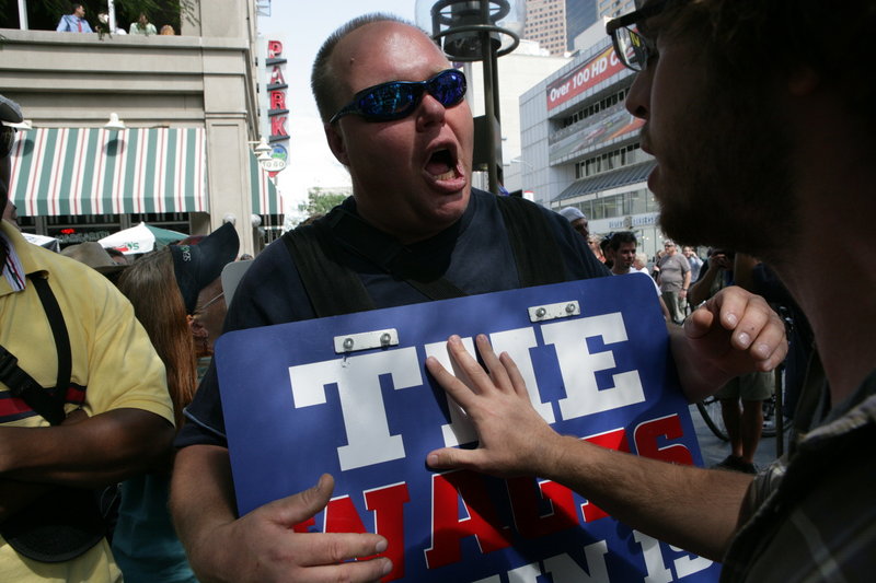 Tim Schultheis expresses his religious views in 2008 outside the Democratic National Convention in Denver. The host cities for this year’s national political conventions are gearing up to provide security, but their state laws allow concealed weapons.