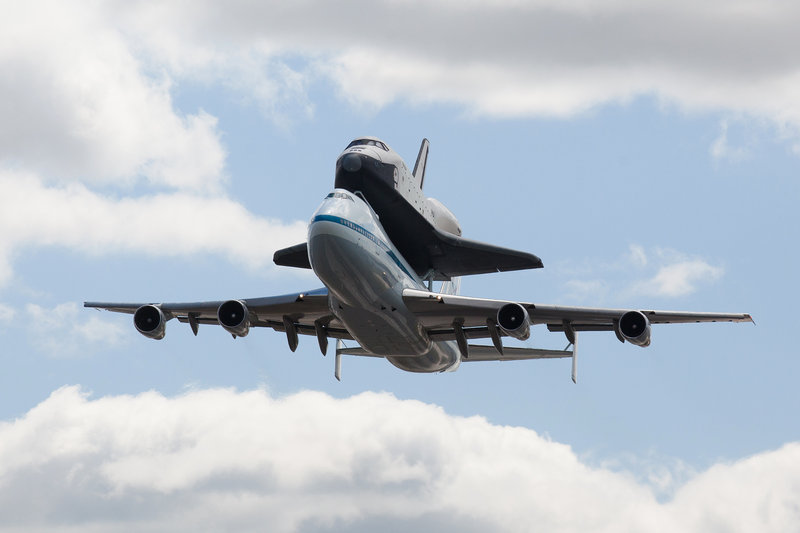 The space shuttle Enterprise, on the back of the NASA 747 Shuttle Carrier Aircraft, flies over New York on its last flight before it becomes a museum piece.