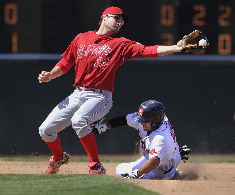 Reading’s Tim Kennelly can’t handle the throw as Portland’s Ryan Dent slides safely into second base during their game Saturday. The Sea Dogs won 9-1 following a strong outing from rehabbing Red Sox pitcher Daisuke Matsuzaka.