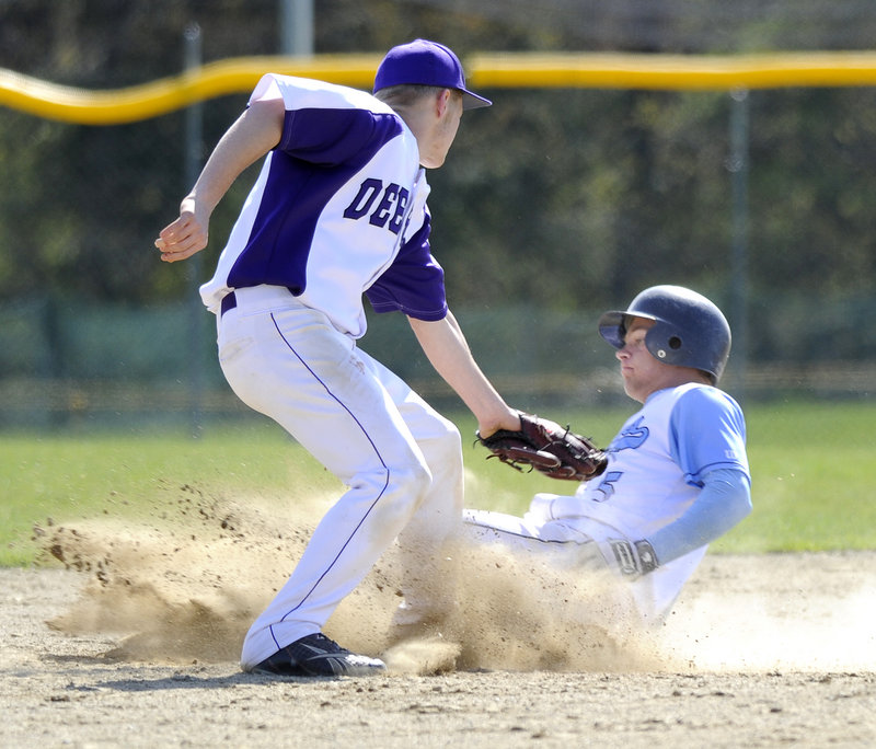 Kyle Heath slides safely into second base ahead of the tag by Deering’s Luke Boyle. Heath’s two-run double in the second inning put Westbrook ahead for good.