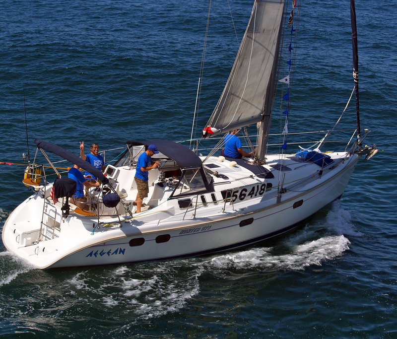 Crew members aboard the 37-foot Aegean prepare Friday for the start of a 124-mile yacht race from Newport Beach, Calif., to Ensenada, Mexico. The Aegean, carrying a crew of four, was reported missing Saturday, the Coast Guard said.