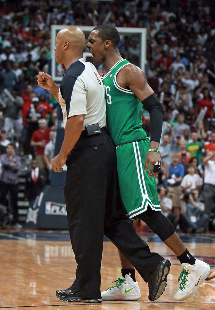 Celtics guard Rajon Rondo bumps into referee Marc Davis after getting called for a technical foul late in Sunday’s game. Rondo was ejected, and Boston’s late comeback bid fell short in an 83-74 loss at Atlanta.