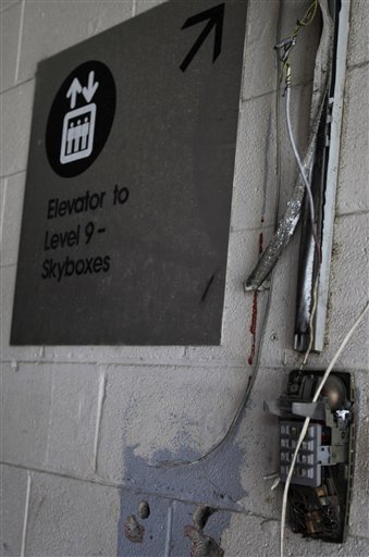 A broken telephone and cut hoses and wires hang on a corridor wall in the Astrodome Monday, May 21, 2012, in Houston. Once touted as the Eighth Wonder of the World, the nation's first domed stadium sits quietly gathering dust and items for storage. (AP Photo/Pat Sullivan)
