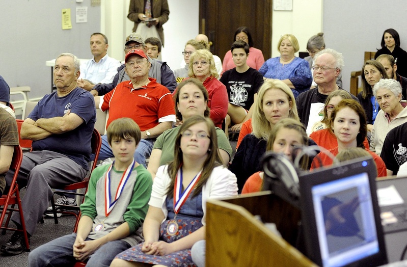 Members of the public listen to a speaker Monday as the Sanford School Committee holds a hearing on changing the name Redskins for Sanford High School teams.