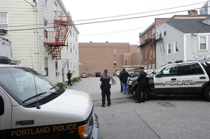 Portland police officers at the scene of a stabbing earlier today on Cedar Street.