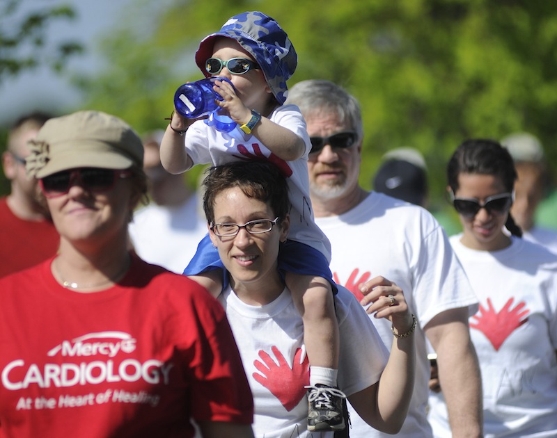 Hamilton Greene, 2, gets a ride from his mom, Carrie Greene of Dayton, while participating in the American Heart Association's Southern Maine Heart Walk on Sunday.