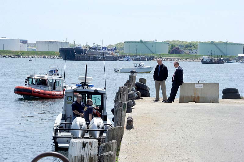 Members of the Portland police dive team search the waters near the State Pier on Monday, May 21, 2012 for a Harvard student who went missing after a night with friends in the Old Port.
