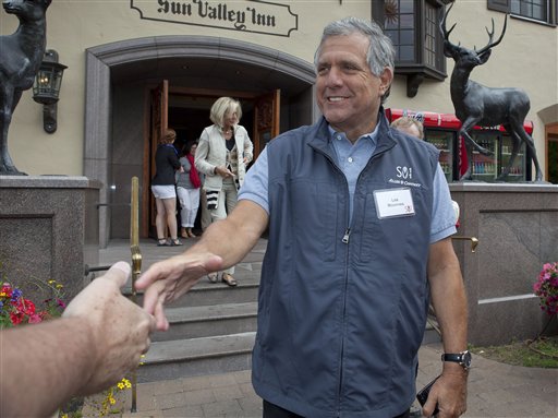 FILE - In this Thursday, July 7, 2011 file photo, Les Moonves, president and CEO of CBS Corporation, greets a member of the media at the Sun Valley Inn for the 2011 Allen and Co. Sun Valley Conference in Sun Valley, Idaho. Moonves is one of the top 10 highest paid CEOs at publicly held companies in America last year, according to calculations by Equilar, an executive compensation data firm, and The Associated Press. The Associated Press formula calculates an executive's total compensation during the last fiscal year by adding salary, bonuses, perks, above-market interest the company pays on deferred compensation and the estimated value of stock and stock options awarded during the year. (AP Photo/Julie Jacobson, File)