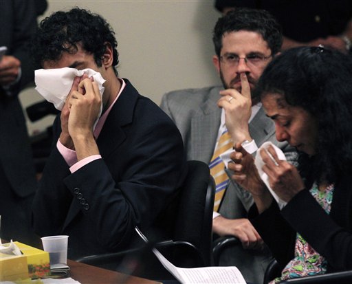 As defense attorney Philip Nettl, center, looks on Dharun Ravi, left,and his mother, Sabitha Ravi cry as she reads a statement during a sentencing hearing for Ravi in New Brunswick, N.J., Monday, May 21, 2012. Ravi, a former Rutgers University student who used a webcam to watch his roommate kiss another man days before the roommate killed himself was sentenced Monday to 30 days in jail. A judge also gave 20-year-old Dharun Ravi three years of probation. (AP Photo/Mel Evans)