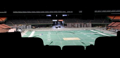 Old, wrinkled Astroturf for football lays across the floor of the Astrodome Monday, May 21, 2012, in Houston. Once touted as the Eighth Wonder of the World, the nation's first domed stadium sits quietly gathering dust and items for storage. (AP Photo/Pat Sullivan)