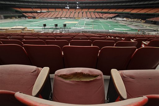 Rows of dirty, tattered seats ring the Astrodome Monday, May 21, 2012, in Houston. Once touted as the Eighth Wonder of the World, the nation's first domed stadium sits quietly gathering dust and items for storage. (AP Photo/Pat Sullivan)