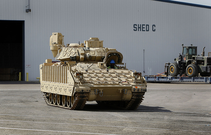Labs at the Tank Automotive Research Development and Engineering Center in Warren, Mich., are using Bradley fighting vehicles to test a system to turn exhaust heat into electricity to power a tank’s computer, which could eventually become a fuel-saving technology for consumers. This military vehicle is shown at the Port of Beaumont in Texas.