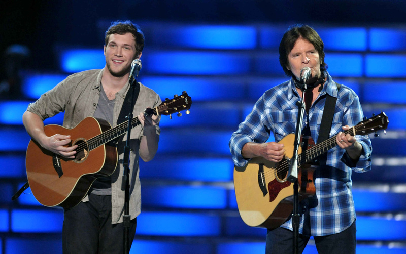Finalist Phillip Phillips, left, and John Fogerty perform onstage at the "American Idol" finale on Wednesday.