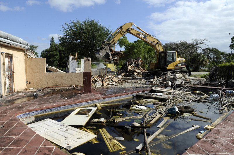 The city of Fort Lauderdale demolishes a house last month after deeming it an unsafe structure. The house had been in foreclosure limbo with the former CitiFinancial, now OneMain Financial, for more than three years. krt2012 krtusbusiness krtmacroecon macroeconomics macro economics BNK FIN REA krtnational national krtedonly 04000000 04008001 krtbusiness business debt market krtrealestate real estate mortgage 04004003 central bank krtmarket market 04008003 u.s. us united states mct krtnamer north america 04008021 04008002 consumer issue krtconstruction construction property krtbank banking bank 04008022 loan 2012