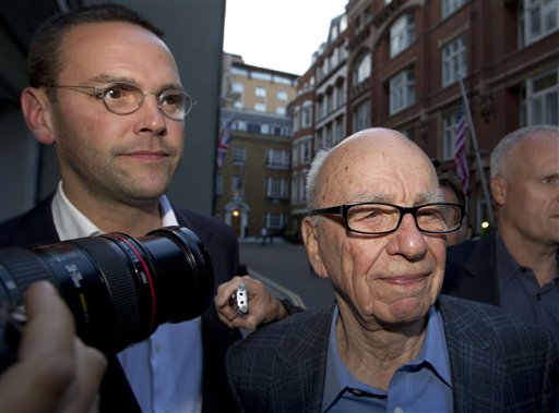 Chairman of News Corporation Rupert Murdoch, right, and his son James Murdoch, arrive at his residence in central London in this July 2011 photo.