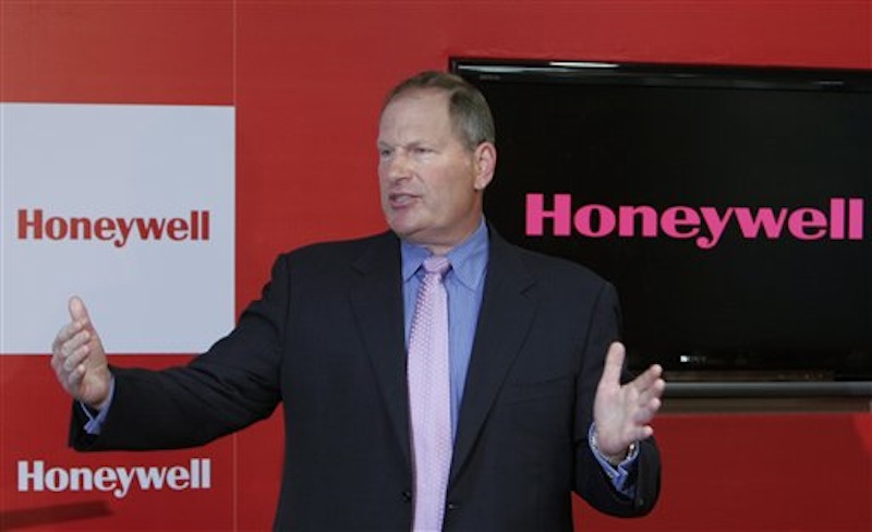 In this May 7, 2009 file photograph, Honeywell Chairman and Chief Executive Officer Dave Cote speaks after inaugurating the company's new facility in Bangalore, India. Cote is one of the top 10 highest paid CEOs at publicly held companies in America last year, according to calculations by Equilar, an executive compensation data firm, and The Associated Press. The Associated Press formula calculates an executive's total compensation during the last fiscal year by adding salary, bonuses, perks, above-market interest the company pays on deferred compensation and the estimated value of stock and stock options awarded during the year. (AP Photo/Aijaz Rahi, file)