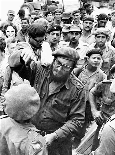 Fidel Castro, center, in an April 1961 photo with members of the Revolutionary Armed Forces at his base of operations at the Australia Sugar Refinery in Jaguey, near Playa Giron, during the Bay of Pigs invasion.