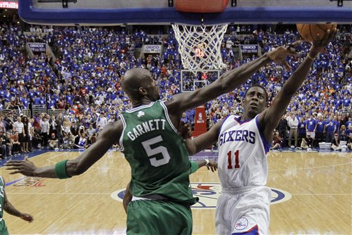 Philadelphia 76ers' Jrue Holiday, right, goes up for a shot as Boston Celtics' Kevin Garnett defends during the second half of Game 6 of an NBA basketball Eastern Conference semifinal playoff series on Wednesday The Associated Press