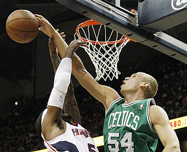 Atlanta Hawks Josh Smith has his shot blocked by Boston Celtics center Greg Stiemsma during the first half of Game 5 of playoff series game on Tuesday in Atlanta.