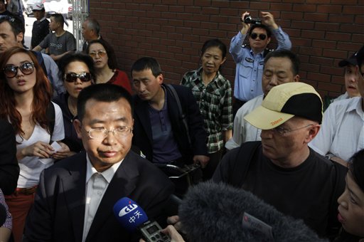 Human rights activist Jiang Tianyong speaks to journalists outside a hospital after his failed attempt to see blind Chinese activist Chen Guangcheng.