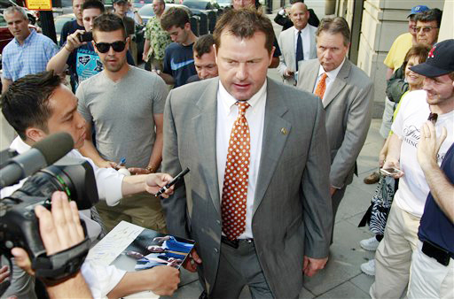 After signing autographs, former Major League Baseball pitcher Roger Clemens leaves federal court on Thursday in Washington.