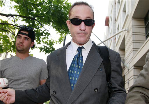 Brian McNamee, former trainer to Roger Clemens, leaves federal court in Washington on Thursday.