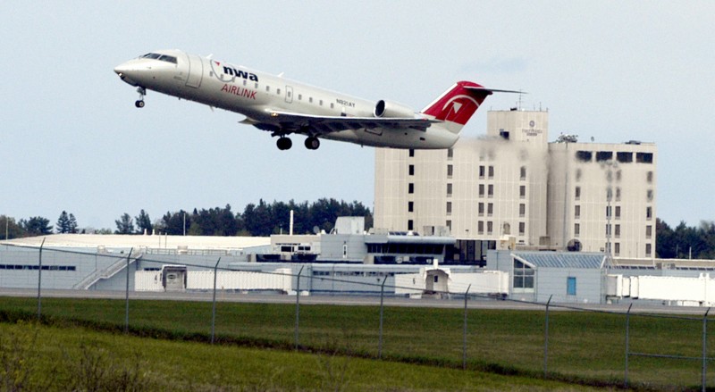 FILE- In this May 18, 2005 file photo, a passenger jet lifts off from the runway at Bangor International Airport in Bangor, Maine. Because of the airport's location at the northeastern corner of the U.S., trans-Atlantic flights confronted with terror threats or unruly passengers are often diverted to Bangor, population 33,000. (AP Photo/Bob DeLong)