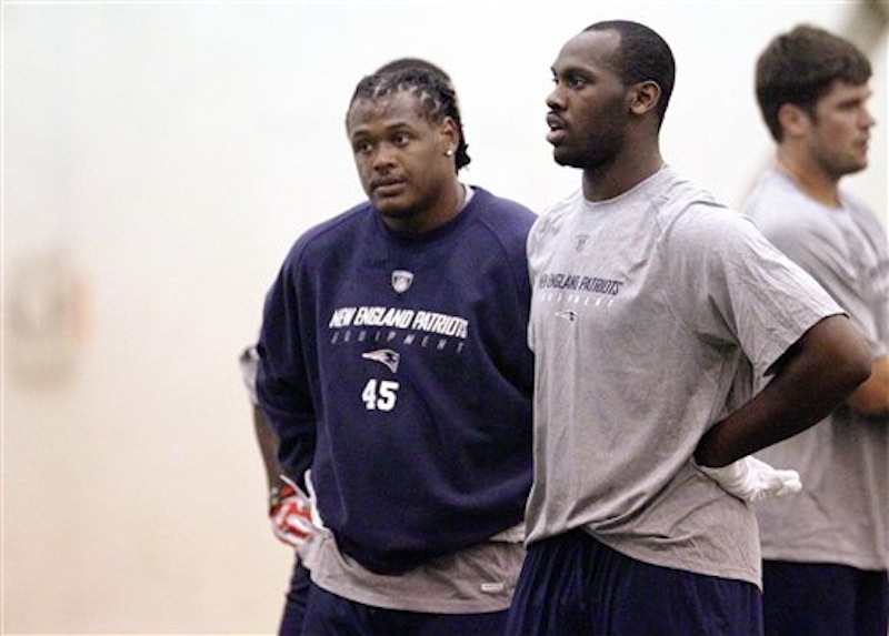 New England Patriots defensive rookie players Dont'a Hightower (45) and Chandler Jones, both selected in the first round of the draft, catch their breath during NFL football rookie minicamp at the team's facility in Foxborough, Mass., Friday, May 11, 2012. (AP Photo/Stephan Savoia)