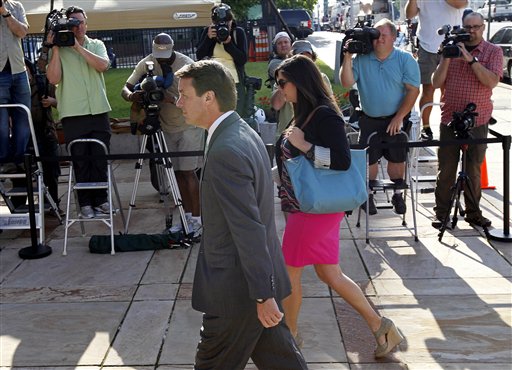 Former presidential candidate and Sen. John Edwards and his daughter Cate Edwards arrive at the federal courthouse in Greensboro, N.C., on Thursday. Edwards has pleaded not guilty to six counts related to campaign finance violations over nearly $1 million from two wealthy donors used to help hide the Democrat's pregnant mistress as he sought the White House in 2008.