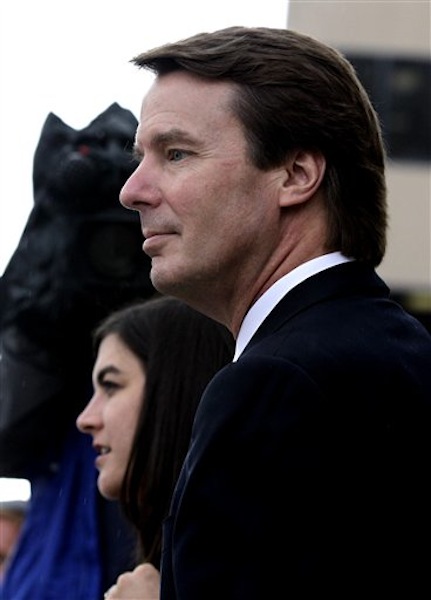 Former presidential candidate and Sen. John Edwards, front, leaves a federal courthouse with his daughter Cate Edwards, back, in Greensboro, N.C., Tuesday, May 8, 2012. Edwards is accused of conspiring to secretly obtain more than $900,000 from two wealthy supporters to hide his extramarital affair with Rielle Hunter and her pregnancy. He has pleaded not guilty to six charges related to violations of campaign-finance laws. (AP Photo/Chuck Burton)