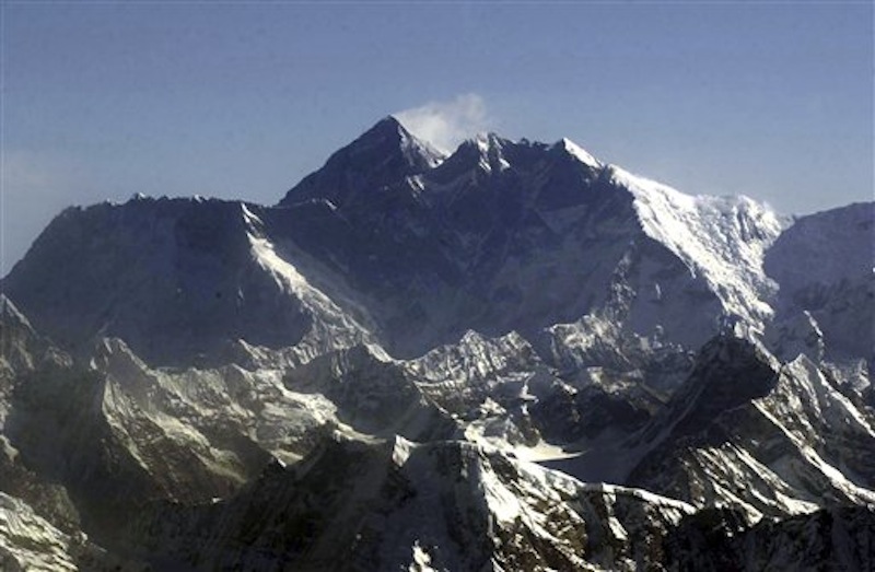 In this Tuesday, May 6, 2003 file photo, Mount Everest, at 8,850-meter (29,035-foot), the world's tallest mountain situated in the Nepal-Tibet border as seen from an airplane. Days after four people died amid a "traffic jam" of climbers scrambling to conquer Mount Everest, Nepal officials said a similar rush up the world's tallest peak will begin soon, and there's little they can do to control it. (AP Photo/Binod Joshi, File)