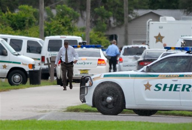 Emergency personel surround the scene of a multiple shooting in Port St. John, Brevard County, Fla., Tuesday, May 15, 2012. Sheriff's deputies in Brevard County said 33-year-old Tanya Thomas on Tuesday shot her four children, who ranged in age from 12 to 17, before shooting herself. (AP Photo/Florida Today,Tim Shortt) murder;suicide;killings;PSJ shootings