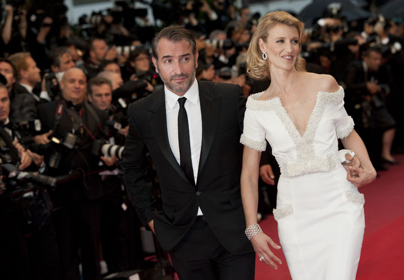 Actor Jean Dujardin, left, and Alexandra Lamy arrive for the awards ceremony at the 65th international film festival, in Cannes, southern France, Sunday, May 27, 2012.