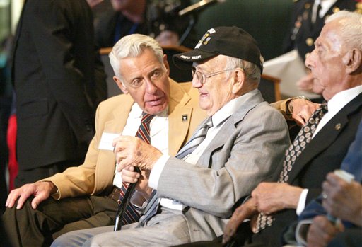 World War II veteran Norman Wasserman, left, of Brooklyn, N.Y., talks with fellow veteran Patsy Veltre, of Nutley, N.J., before they are awarded the French Legion of Honor during a ceremony at the U.S. Military Academy in West Point, N.Y. on Tuesday. The ceremony commemorated the Armistice of May 8th, 1945.