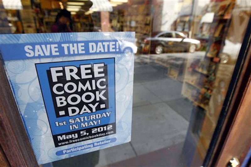 Shown is an advertisement for Free Comic Book Day at Fat Jack's Comicrypt, Friday, May 4, 2012, in Philadelphia. Like hundreds of other comic specialty shops in 46 countries, the store is participating in Free Comic Book day on Saturday, May 5, which sees shops give away free copies of new and reprinted comics from some 40 publishers, including Marvel, DC, Archie, Image, Dark Horse, Valiant and Dynamite, among others, to promote the growth of the medium and garner new readers, some of whom may have been exposed to heroes through television and films. Free Comic Book day started 11 years and continues to expand, said Joe Field, who helped organize the inaugural event. This year, some 3.5 million free comics will be handed out. (AP Photo/Matt Rourke)