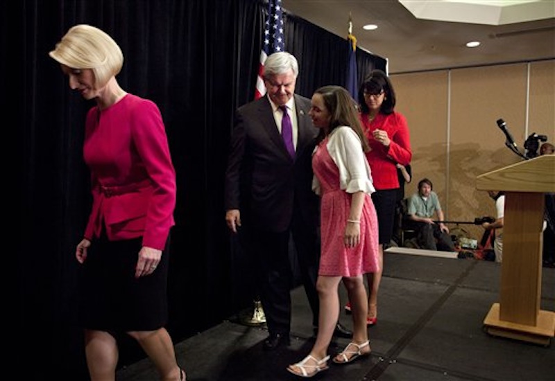 Republican presidential candidate, former House Speaker Newt Gingrich, follows his wife Callista as they walk off stage after he announced that he is ending his presidential campaign, Wednesday, May 2, 2012 in Arlington, Va. (AP Photo/Evan Vucci)