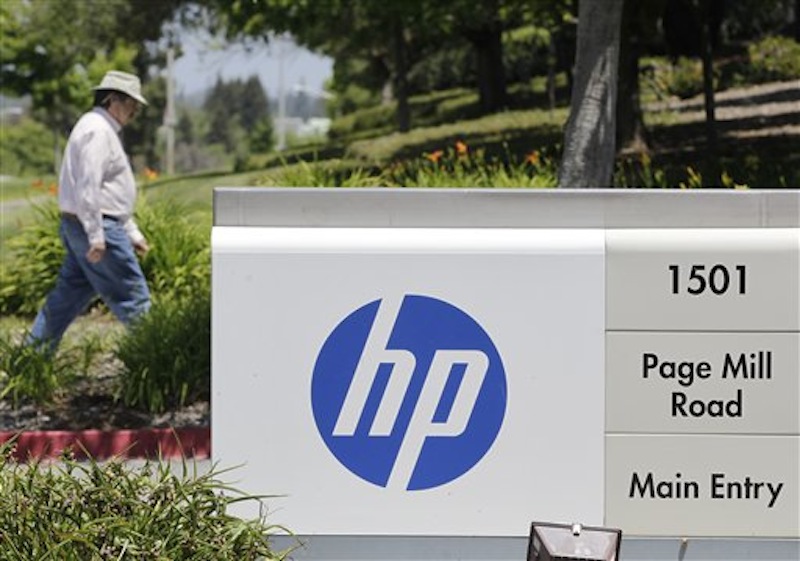 A Hewlett-Packard worker walk in the main entrance of HP Headquarters in Palo Alto, Calif., Thursday, May 17, 2012. Published reports say HP is poised to eliminate up to 30,000 jobs to help offset dwindling demand for personal computers as more people connect to the Internet on smartphones and tablets. Bloomberg News says HP is mulling 25,000 job cuts. All Things D, a technology blog, estimates the purge will jettison 30,000 jobs. Both reports cited unnamed people familiar with HP's plans. Hewlett-Packard Co. declined to comment Thursday. (AP Photo/Paul Sakuma)