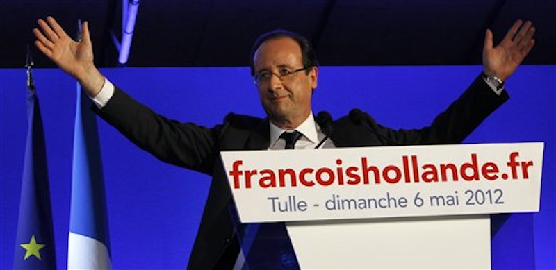 President-elect Francois Hollande waves to the crowd after his election in Tulle, central France, Sunday, May 6, 2012. Francois Hollande defeated Nicolas Sarkozy on Sunday to become France's next president, Sarkozy conceded defeat minutes after the polls closed. (AP Photo/Christophe Ena)