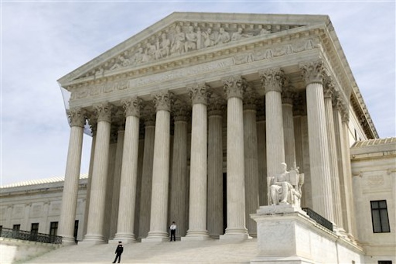 In this March 28, 2012 file photo, the Supreme Court is seen in Washington. The Supreme Court won't reduce the $675,000 verdict against a Boston University student who illegally downloaded 30 songs and shared them on the Internet. (AP Photo/Charles Dharapak, File)