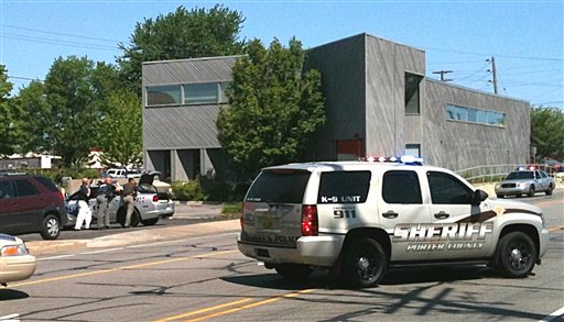 Police surround a real estate office Friday in Valpariso, Ind., where they say a gunman is holding an unknown number of hostages. The Associated Press